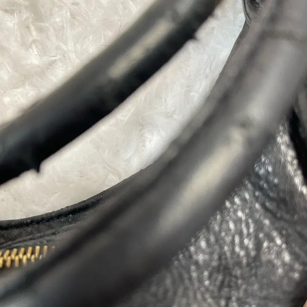 Michael Kors Black Pebble Leather Satchel with gold tone hardwares and accents.